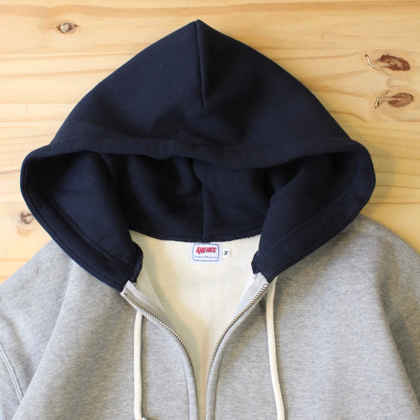 AHE HEE -
NAVY X GREY ZIP UP HOODIE