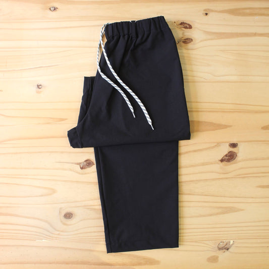 MANUAL ALPHABET -
4WAY NYLON EASY TAPERED PANTS