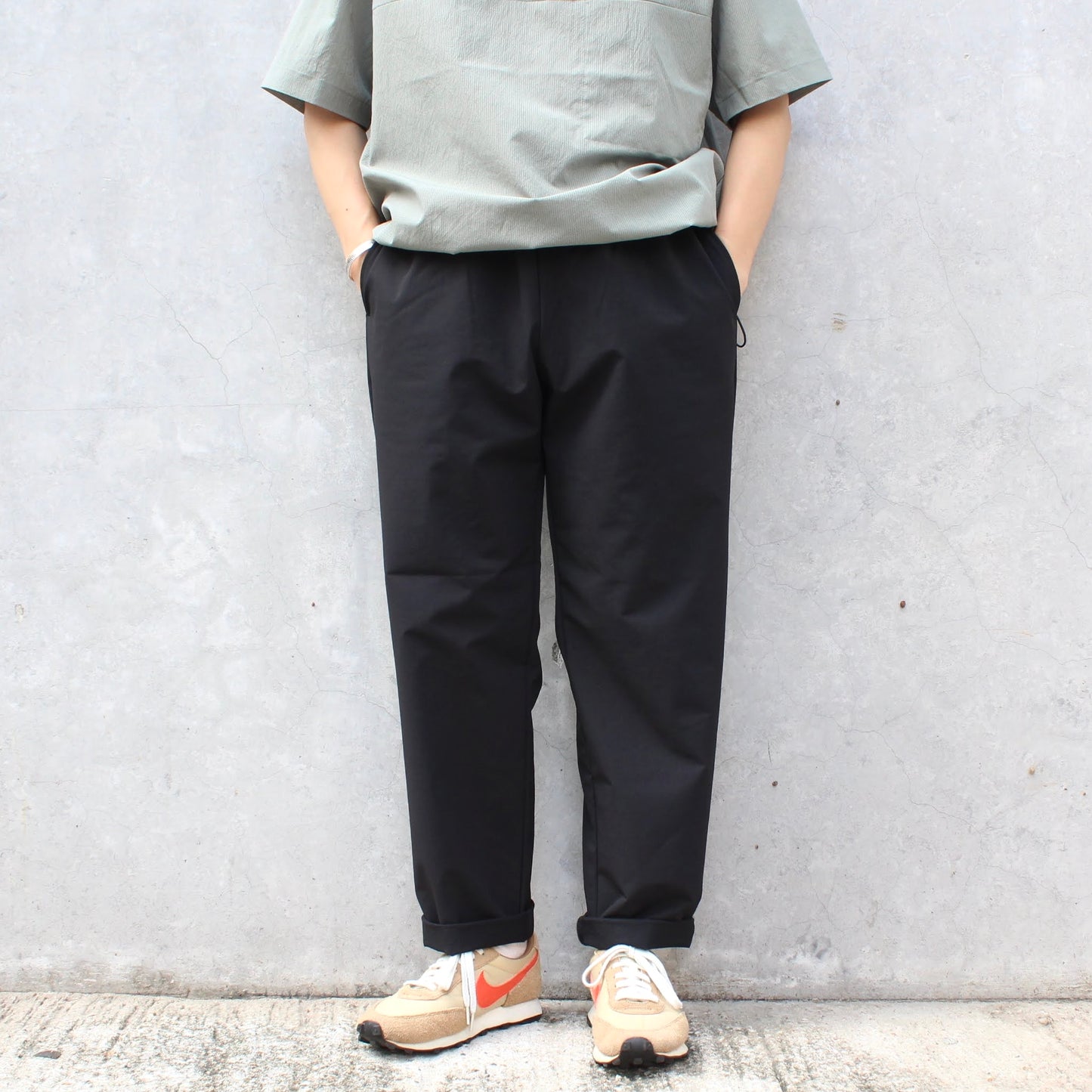 MANUAL ALPHABET -
4WAY NYLON EASY TAPERED PANTS