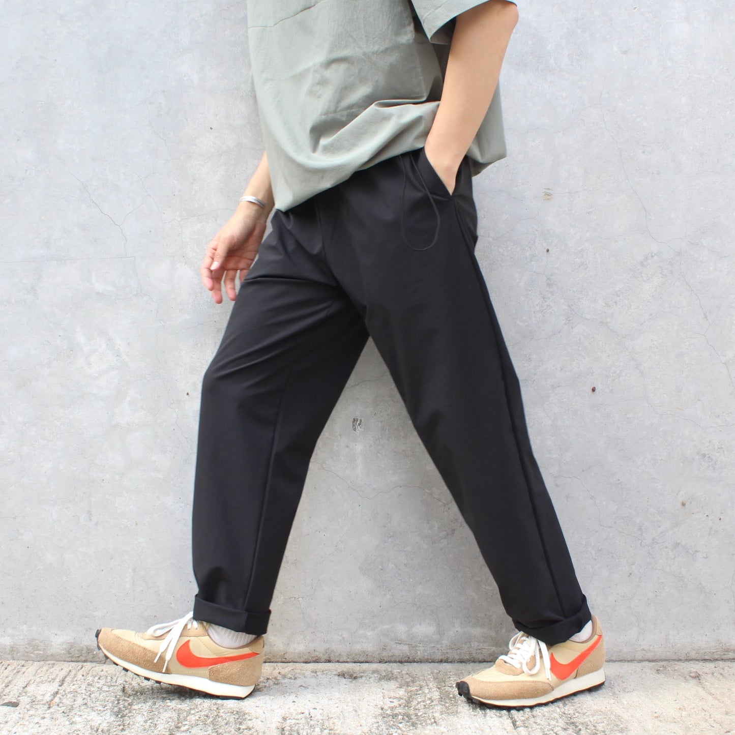 MANUAL ALPHABET -
4WAY NYLON EASY TAPERED PANTS